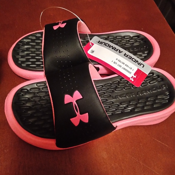 pink and black under armour slides